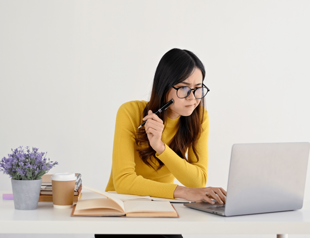 teenager at working on computer with glasses