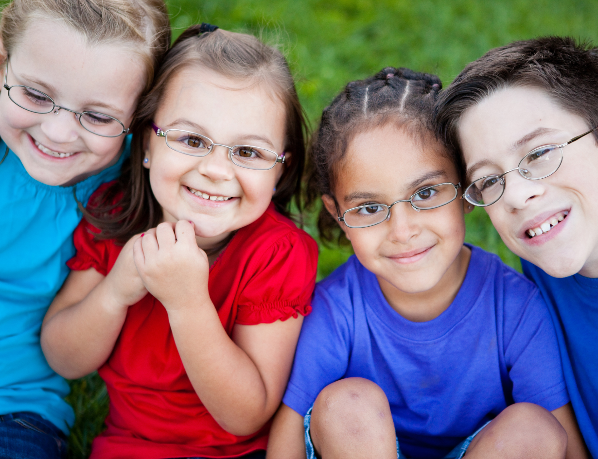 four children wearing glasses